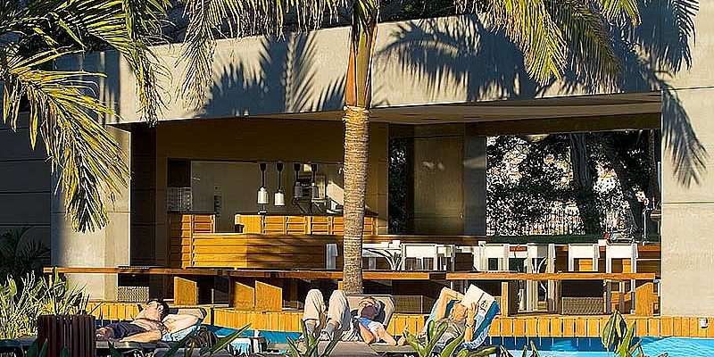 Relax by the pool after golf at Pestana Casino Park hotel Madeira