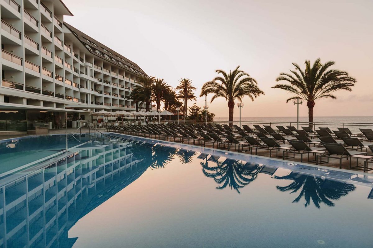 Sunrise over the pool at Hotel Don Gregory by Dunas, Gran Canaria, Canary Islands