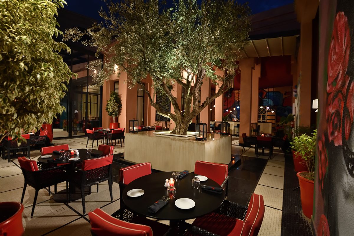Outdoor dining at Movenpick Hotel Manour Eddahbi, Marrakech, Morocco. Golf Planet Holidays.