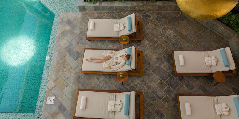 Relax by the pool at the Cypria Maris Beach Hotel and Spa, Paphos, Cyprus. Golf Planet Holidays.