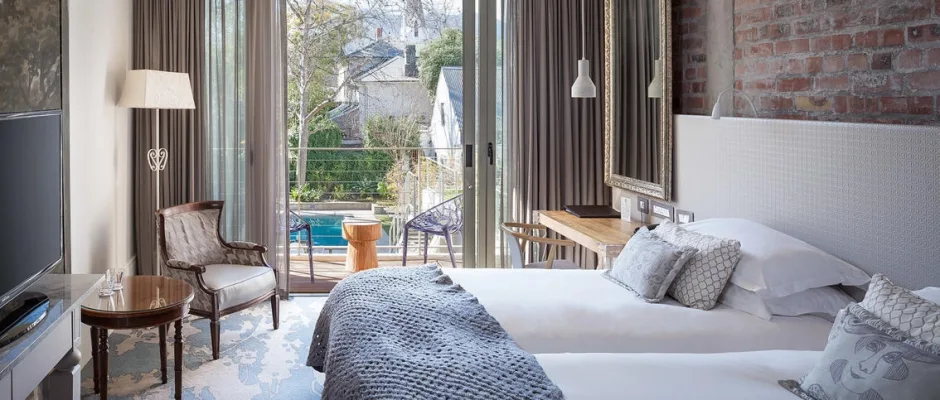 A stylish bedroom at Oude Werf, Stellenbosch, South Africa. Golf Planet Holidays.