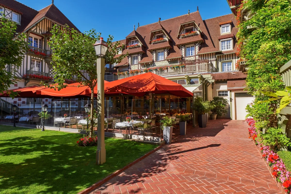 On the terrace at Normandy Barriere Hotel, Deauville, France. Golf Planet Holidays.