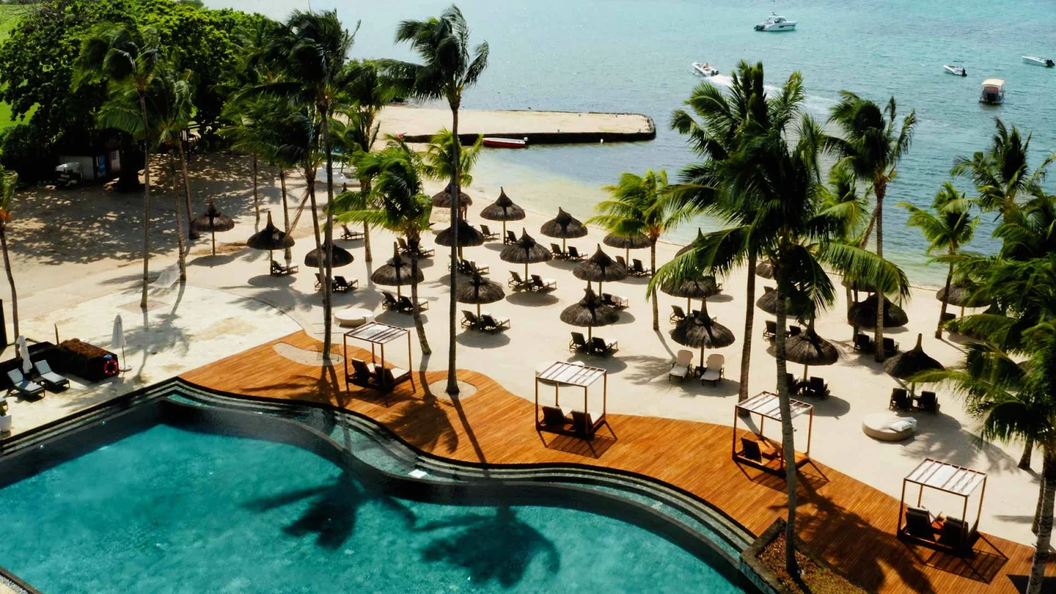 Relax by the beach at Anahita Golf and Spa Resort, Mauritus. Golf Planet Holidays.