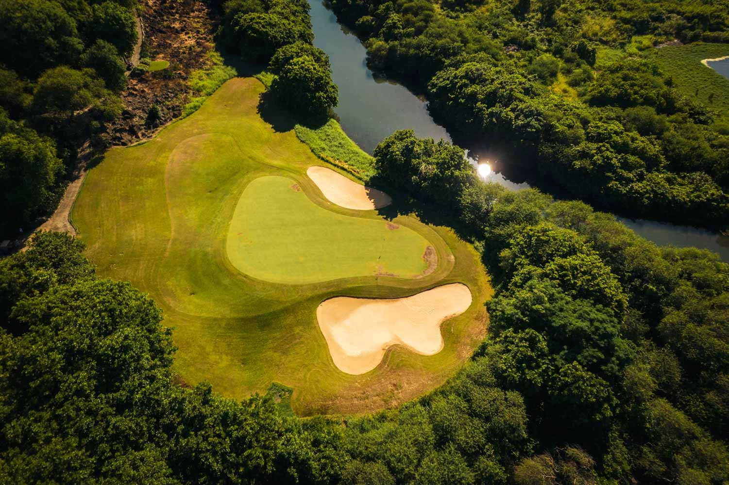 View of the the green at Tamarina Golf course, Mauritius. Golf Planet Holidays.