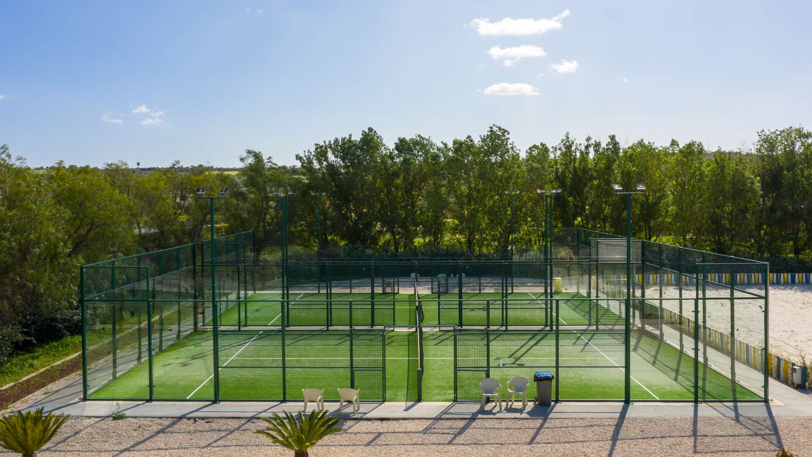 The two floodlit padel courts at Amendoeira Golf Resort's Sports Center