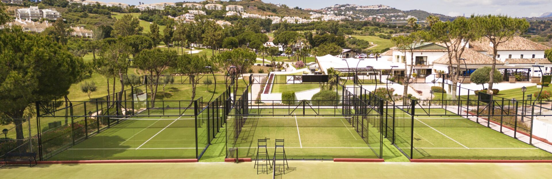 Floodlit padel at La Cala Resort's Racquet Club, beside the clubhouse in Mijas